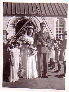 Mr.& Mrs Hammick in front of the school chapel after their wedding in  the school chapel.