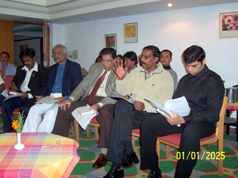 OGs studying the agenda for the Executive Committee meeting - 9th April 2005.