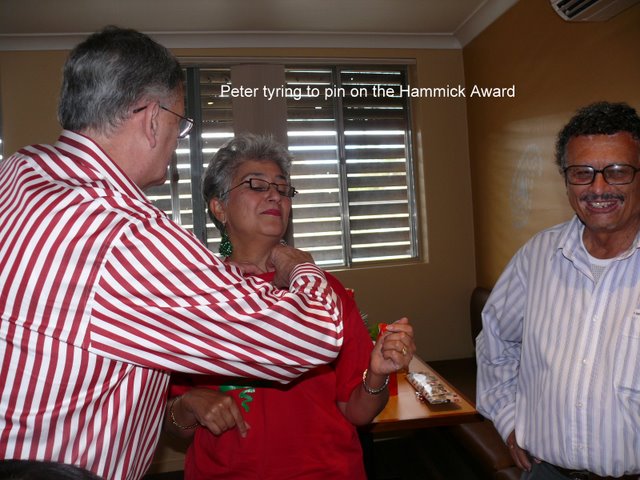 Sydney OGs get together - Dec 2008
Peter Carter pins the Hammick Award on Juene Walmsley, watched by Max French