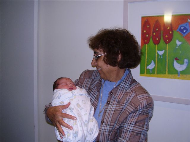 Joan Fowler (nee Tims) cradles her just born 8th Grandchild - Dante - Oct 2006